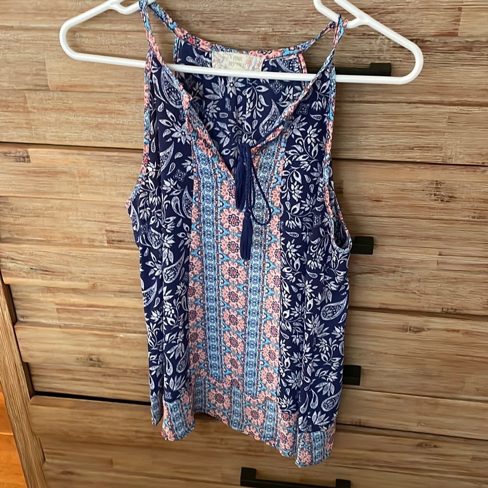 Multi colored top. In excellent condition
